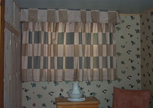Bedroom drape & valance matches the bed cover.
