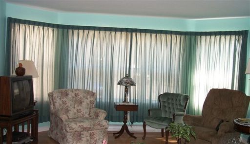 Large bay window..green sheer closed

